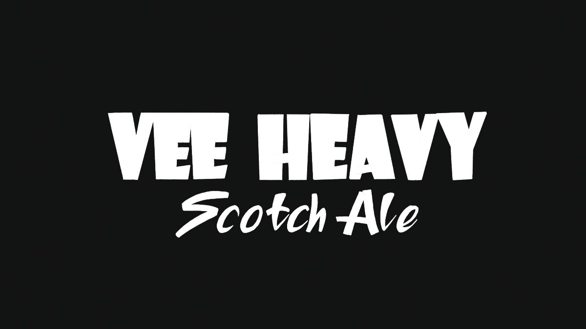Heavy brush display type above a brush script — Vee Heavy Scotch Ale