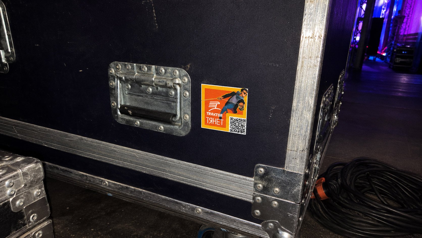 The full set of Traktor stickers laid out in a grid beside a set of keys with a Traktor keyring