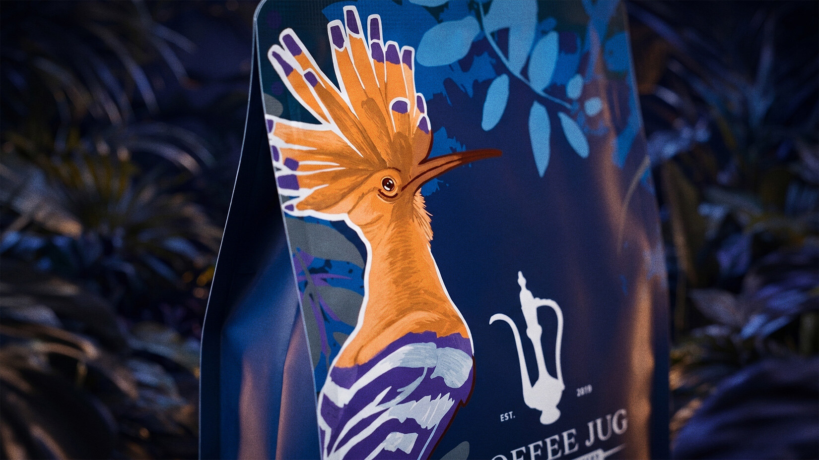 Macro crop of the hoopoe illustration on a Coffee Jug bag, crest fanned out in orange and white