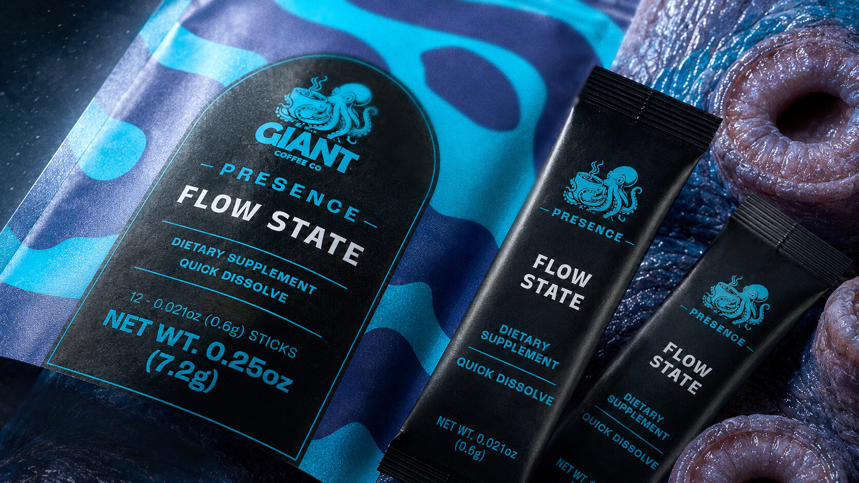 Macro of the Flow State pouch and two individual sticks beside the creature's suckers