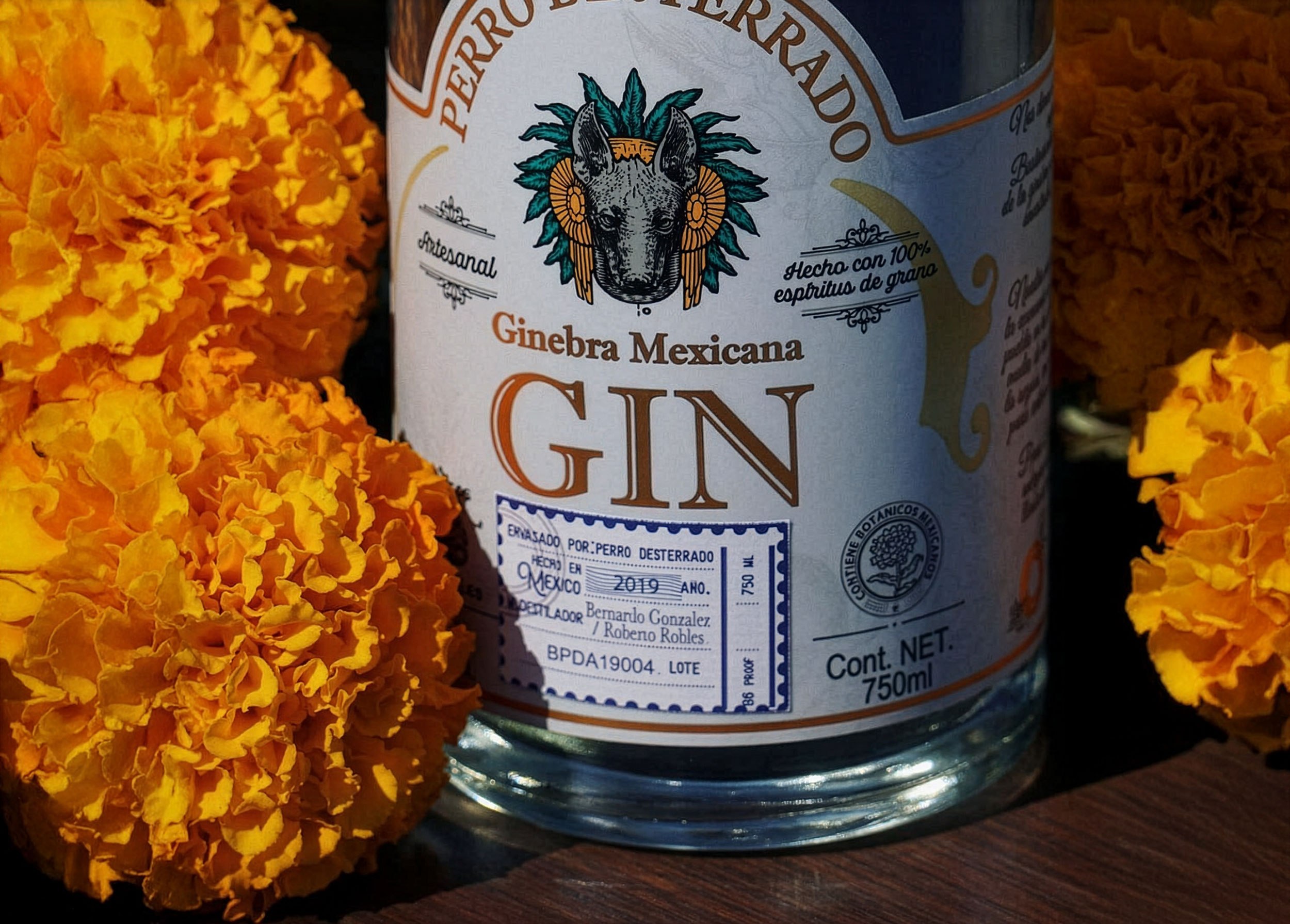 The label in close-up, marigold flowers beside it