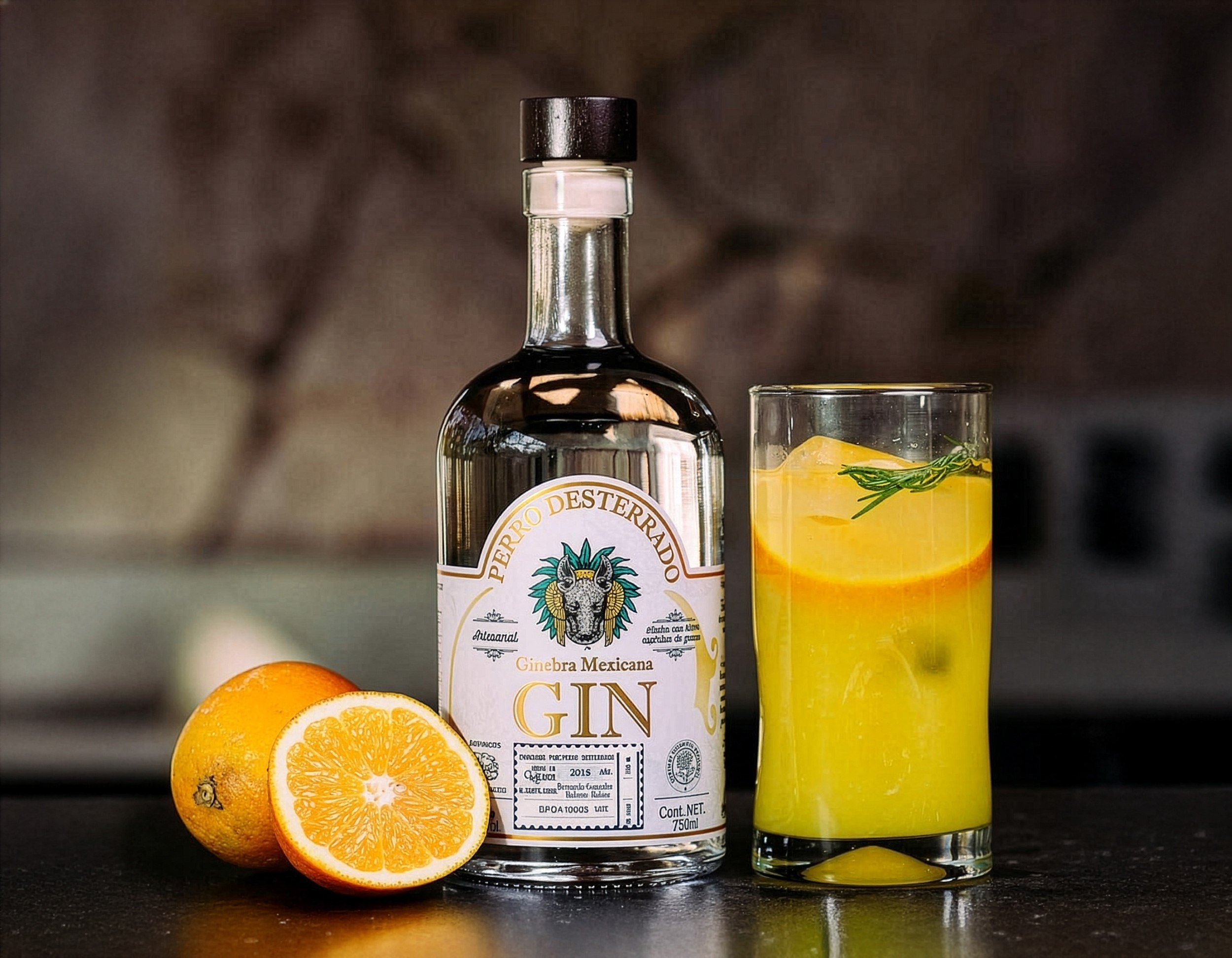 Perro Desterrado beside a gin and orange cocktail