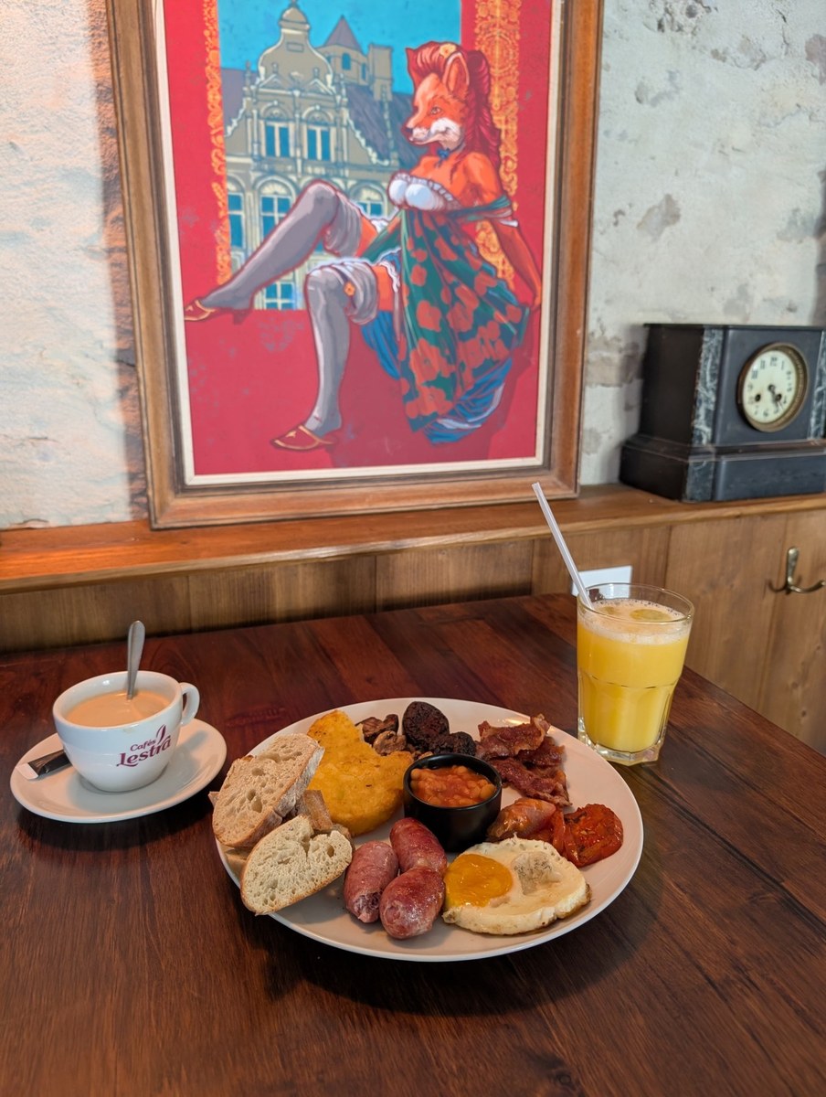 Foxy Red framed above a breakfast table in the taproom