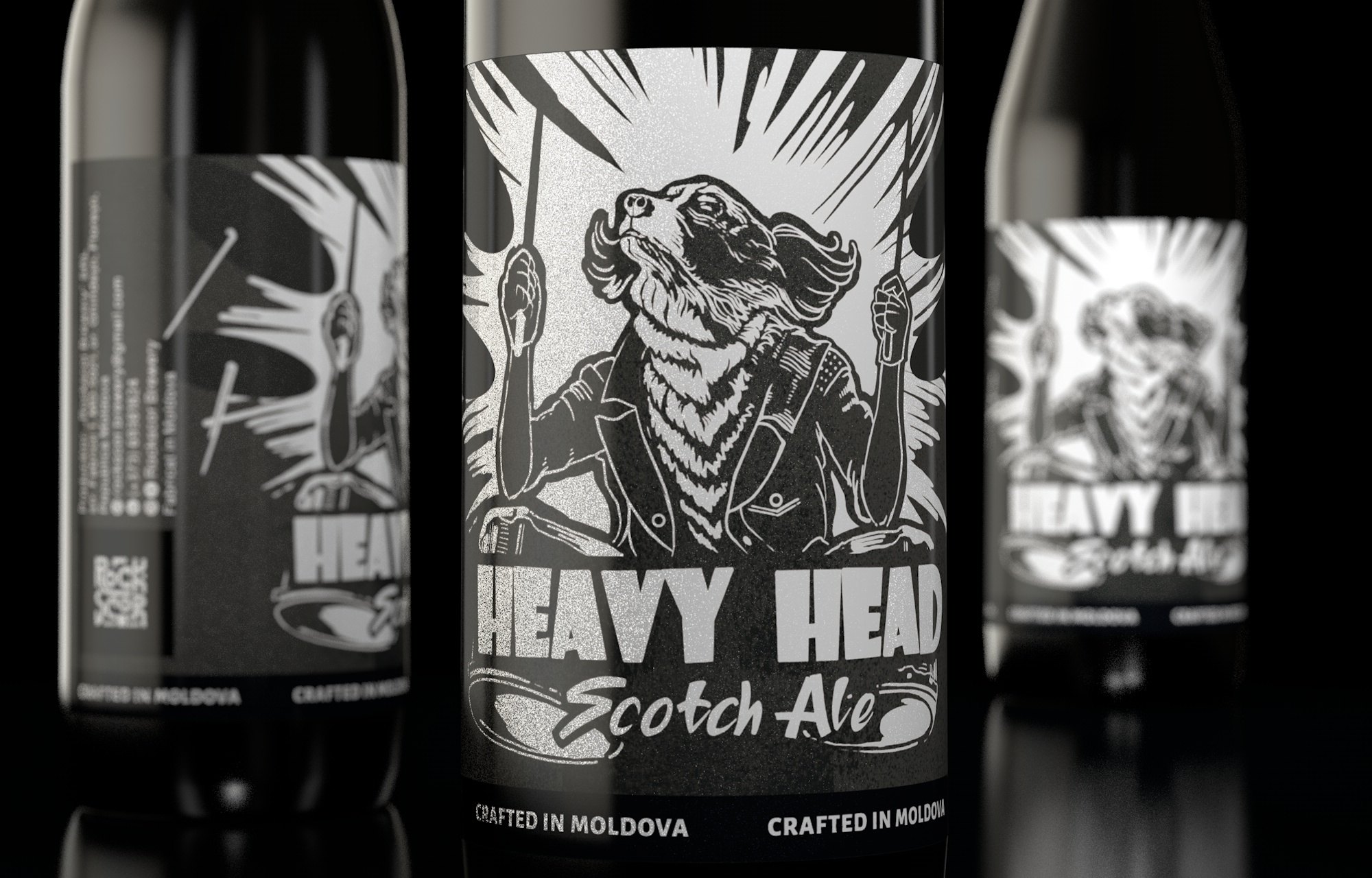 The Heavy Head label in close-up, its black-and-white woodcut style repeated across three bottles