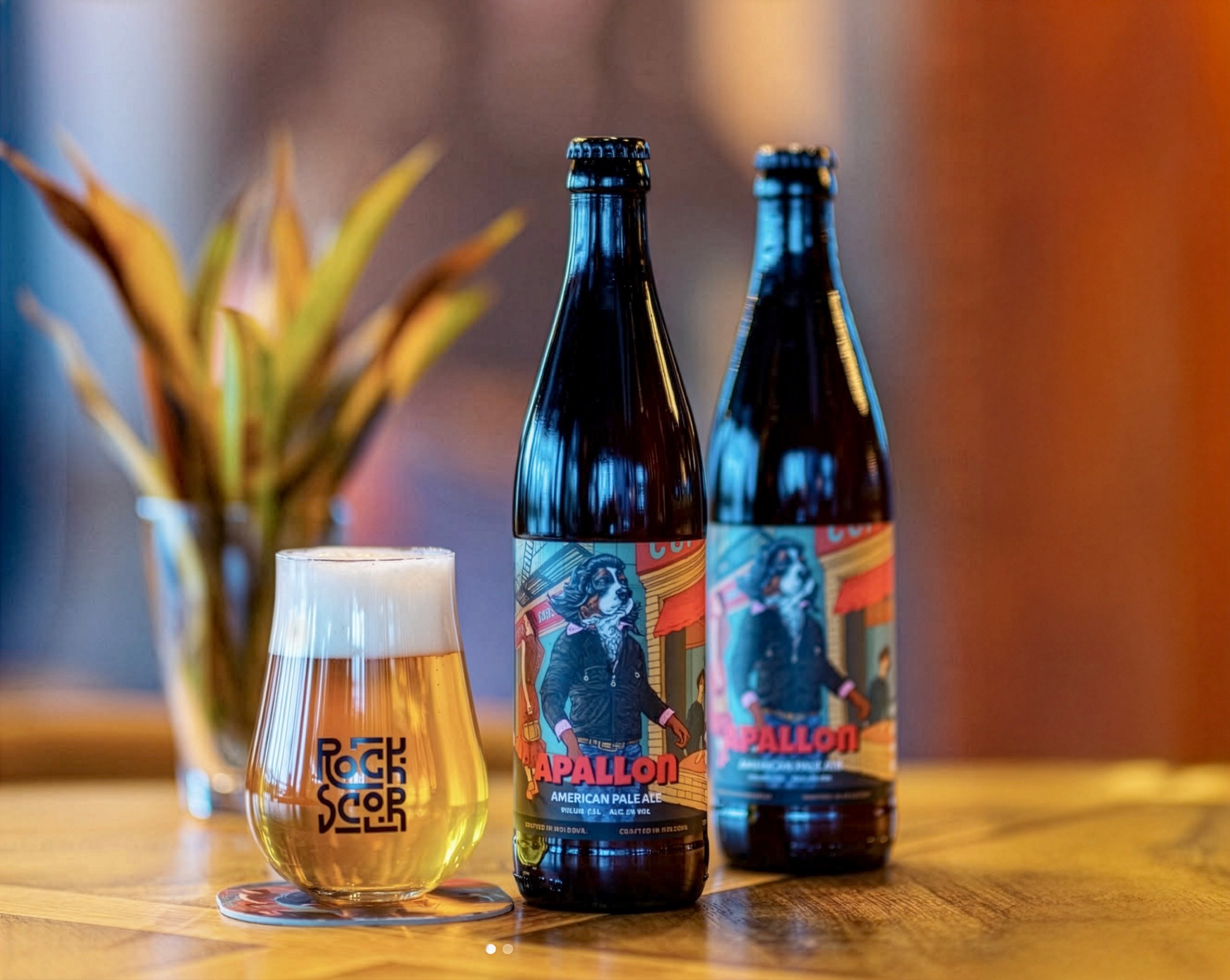 Apallon bottles beside a glass stamped with the Rockscor logo