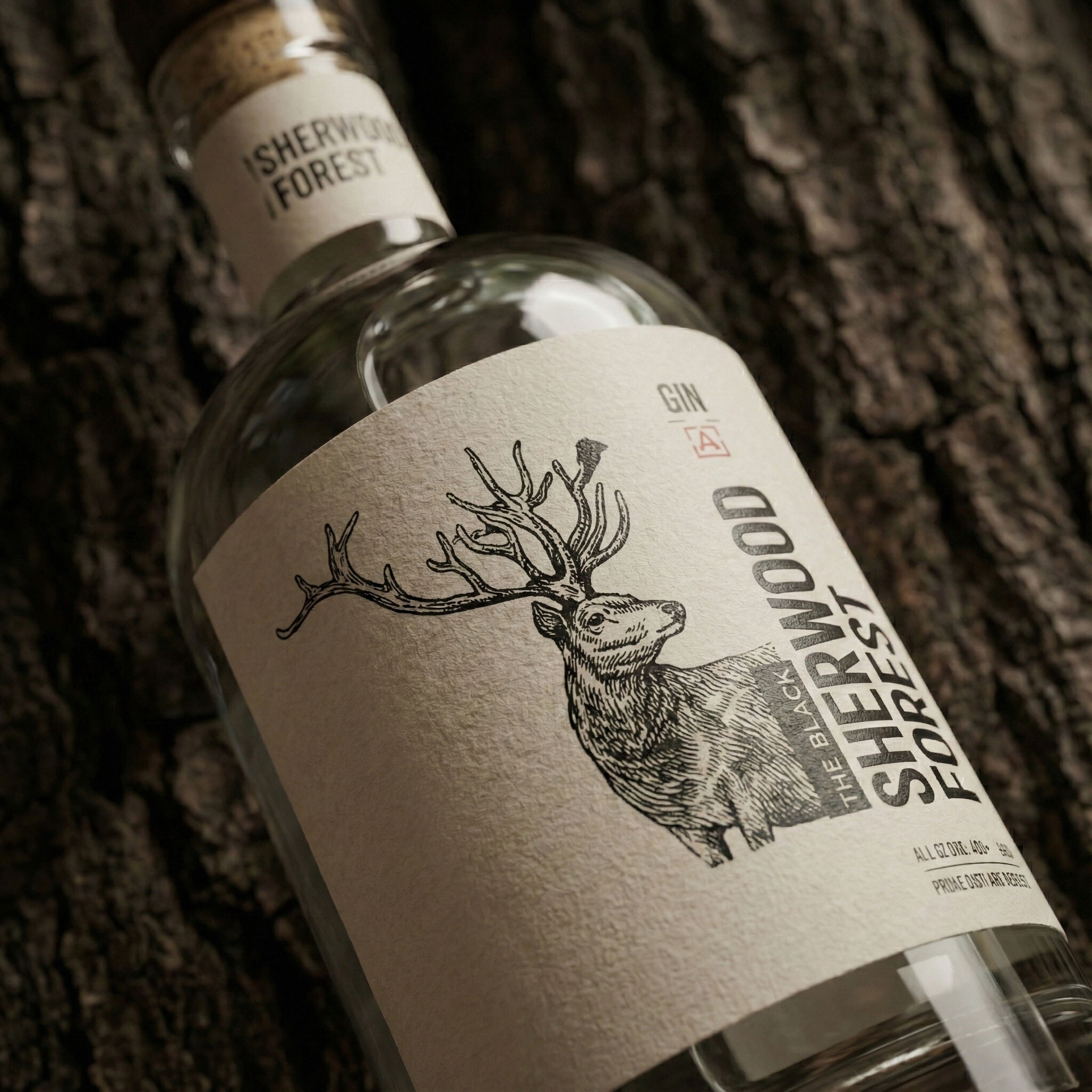 Macro of the label showing the engraved stag, the small bird on its antlers and the vertical type