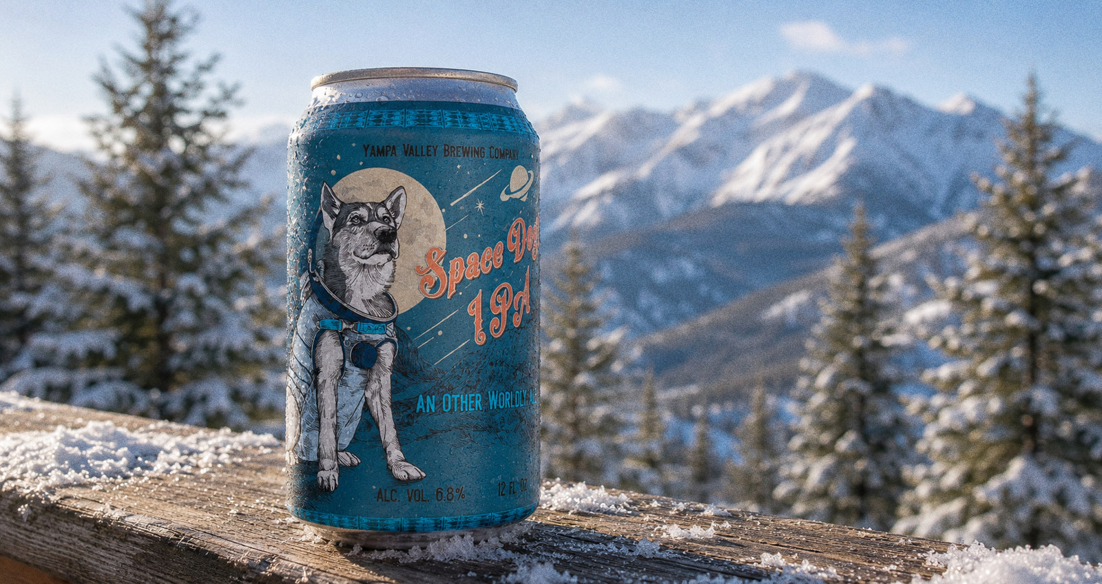 Space Dog IPA — the can on a snowy rail with a mountain view, an engraved husky in a spacesuit on the label