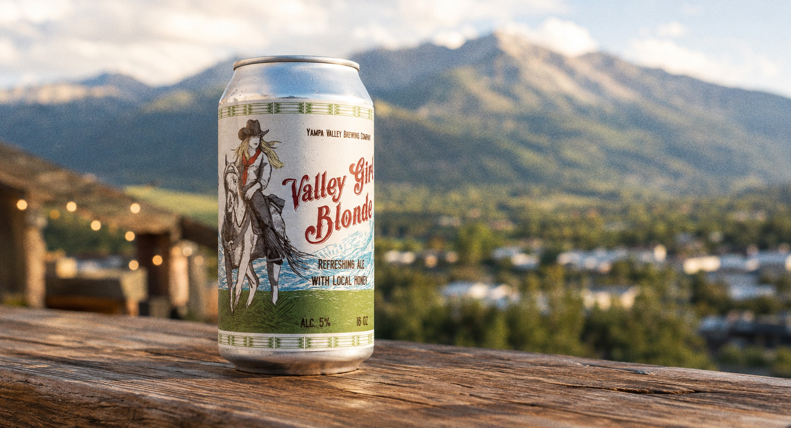 Valley Girl Blonde — the can on a rail above the valley town and mountains