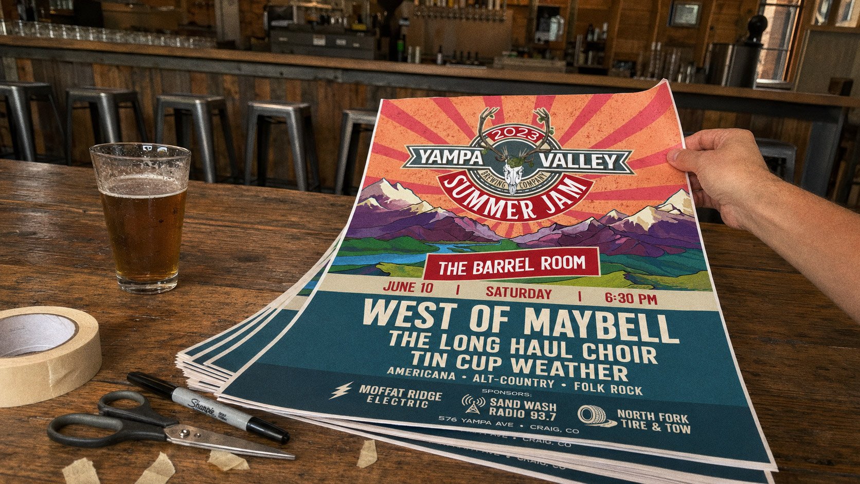 The Summer Jam poster taped by the street door of The Barrel Room, the venue's window logo alongside